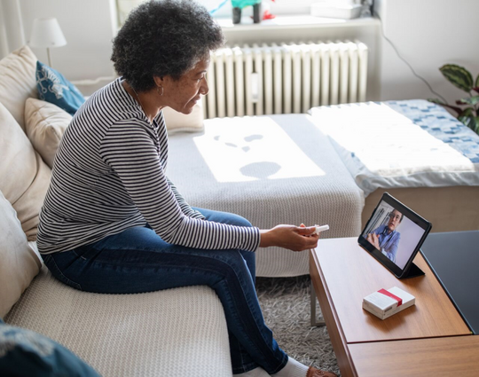 woman on a video call with a doctor