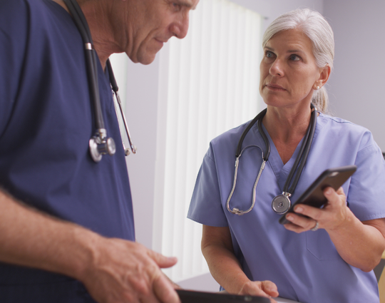 Nurses looking at phones