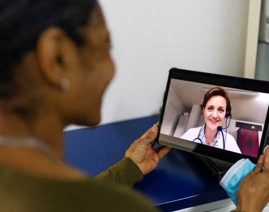 A patient participates in a telehealth visit with their healthcare provider