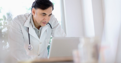 doctor working on laptop