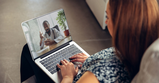 Young woman getting online medical help and advice during videocall with doctor