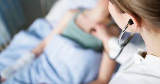 medical professional checking a patient's vital signs