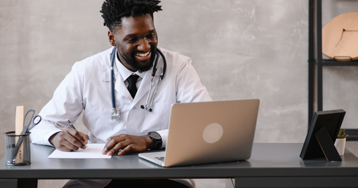 Doctor on video call taking notes