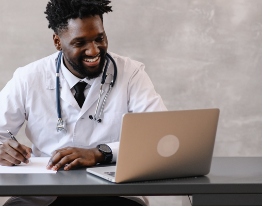 Doctor on video call taking notes