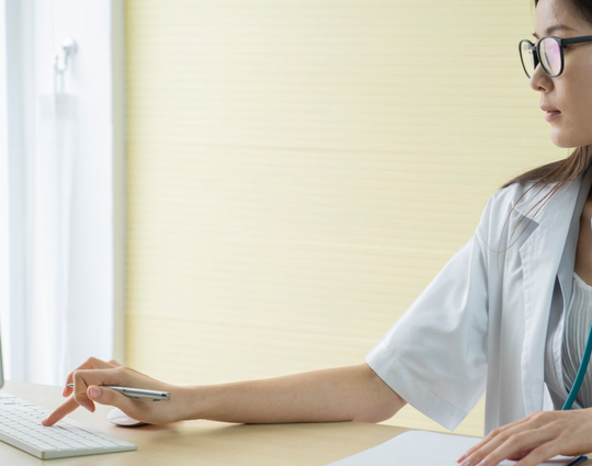 female doctor is working in office